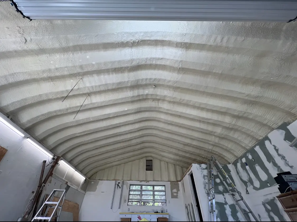 Spray polyurethane foam applied to the underside of a metal roof deck in Charles Town